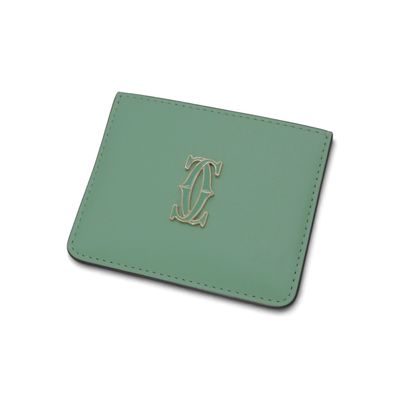 portefeuille en cuir vert orné d'une initiale monogrammée sur le devant