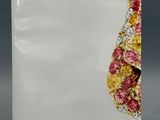 white ceramic plate with pink, yellow, and red flowers on it