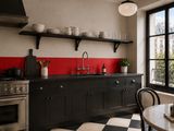 a black and white checkered floor in a kitchen
