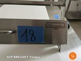 a picture of a stainless steel oven with a blue sticker on it