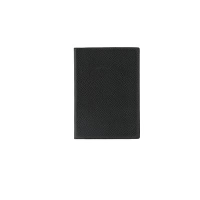 a black passport case sitting on top of a white surface