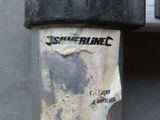 a sticker on the side of a telephone pole