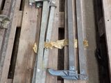 several pieces of wood sit on top of pallets in a warehouse