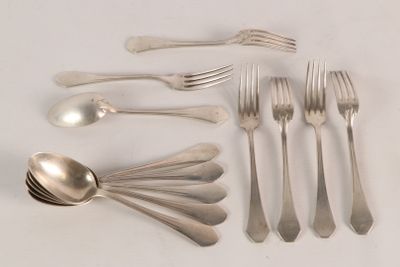 a lot of silver spoons and forks on the table