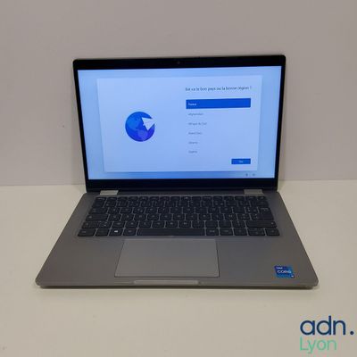 an open laptop computer sitting on top of a white table