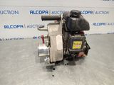 a picture of a small engine on a table in front of a wall