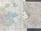 two maps of the united states on display on a wall