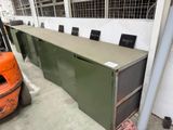 a large metal cabinet in a warehouse with a fork