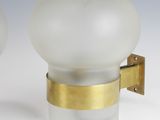 pair of white and gold glass wall lights with brass trims
