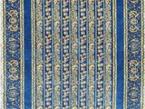 a blue rug with a floral design on it