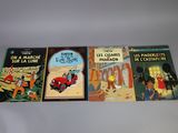 three children ' s books are lined up on a white surface