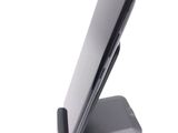 a cell phone that is sitting on top of a stand