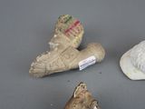 three pieces of clay that have been placed on a table