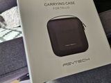 a box with a case on it sitting on a couch