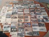 a lot of old postcards on the table