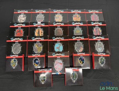 a lot of badges that are on a black table
