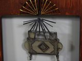 a picture of a clock hanging on a wall