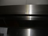 a close up of a stainless steel oven with the door open
