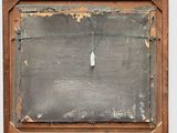 an old wooden frame with a chalkboard hanging from it ' s side