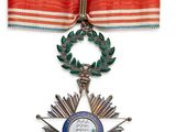 une image représentant une médaille entourée d'un ruban et ornée d'une étoile