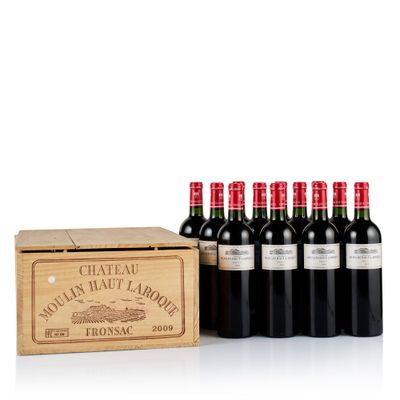 six bottles of red wine in a wooden box with a wooden box