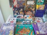 many children ' s books on the bed together