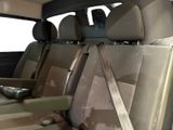 a seat in the back of a car with a remote control