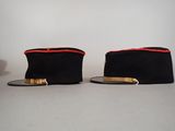 two hats sitting on top of each other on a table