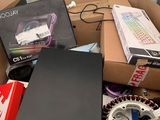 a cardboard box full of electronic equipment and a laptop