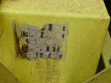 a yellow box that has a bunch of electrical wires on it