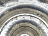 a close up of a silver plate with holes in it