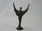 bronze statue of a man holding a bird on a pedestal