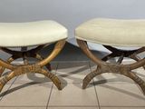 pair of stools with upholstered seat and wooden legs