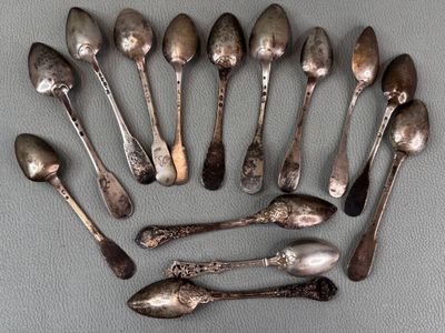 a lot of spoons that are sitting on a table