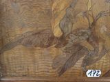 a picture of a picture of a bird in a wood frame