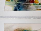 two pictures of watercolor paintings on the wall