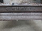 a close up of a metal object with a name plate