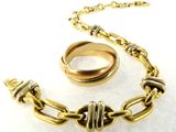 chain link bracelet with two rings and a ring on it