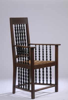 an image of a wooden chair with beads on the back of it