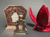 a small red object sitting next to a small red object