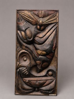 a wooden plaque with a bird and a fish on it