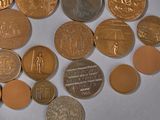 a lot of coins that are on the table
