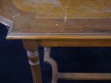 a wooden table with a clock on top of it