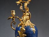 gold and blue vase with flowers and birds on a stand