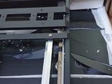 a broken window in a box on the floor