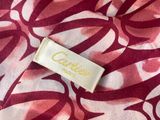 a close up of a pink and white fabric with a label on it