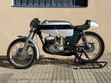 a motorcycle that is parked in front of a building