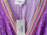 a close up of a purple dress on a hanger