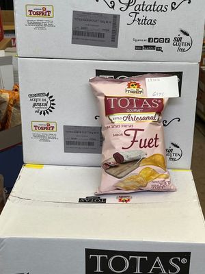 boxes of potato chips are stacked on top of each other in a store