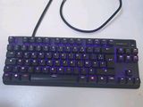 a computer keyboard and mouse sitting on a desk